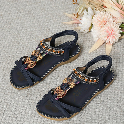 Flair - Sommerliche Bohemian-Zehenstegsandalen mit Blumenverzierung